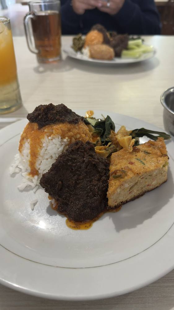 Nasi Padang served with rendang and a whole egg cooked in the rendang sauce